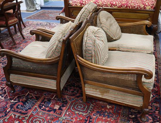 A three piece walnut bergere suite, with single caning